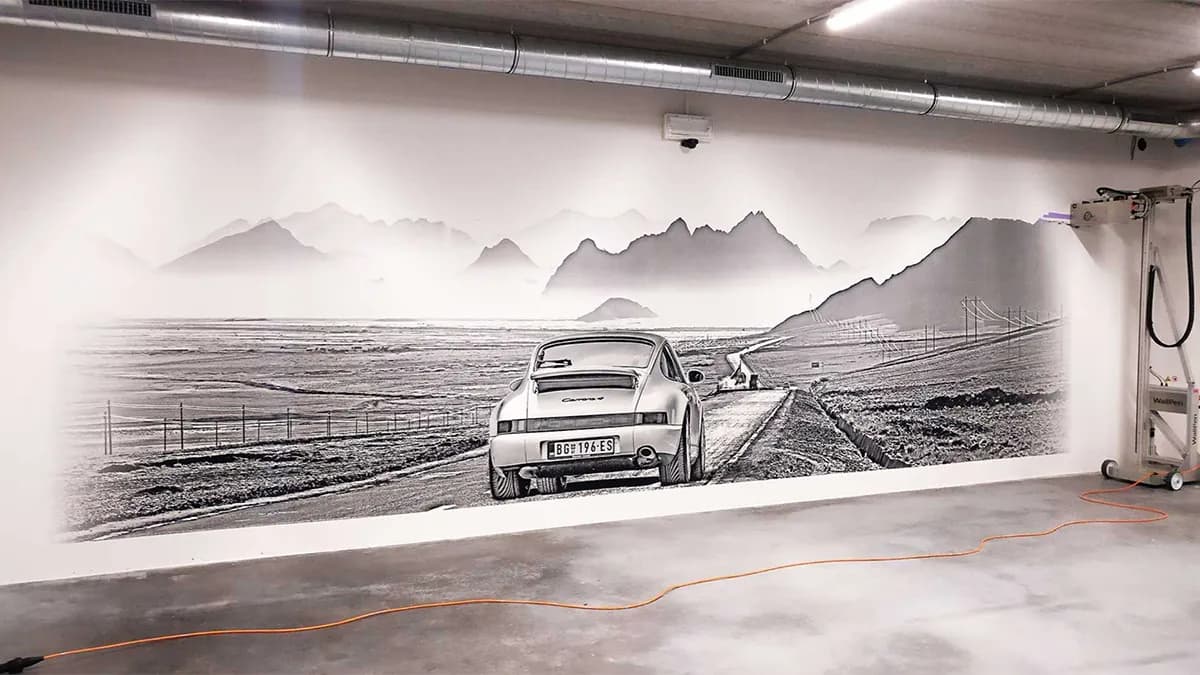 Car workshop wall printing featuring Porsche with mountain landscape by InnoPrint KSA