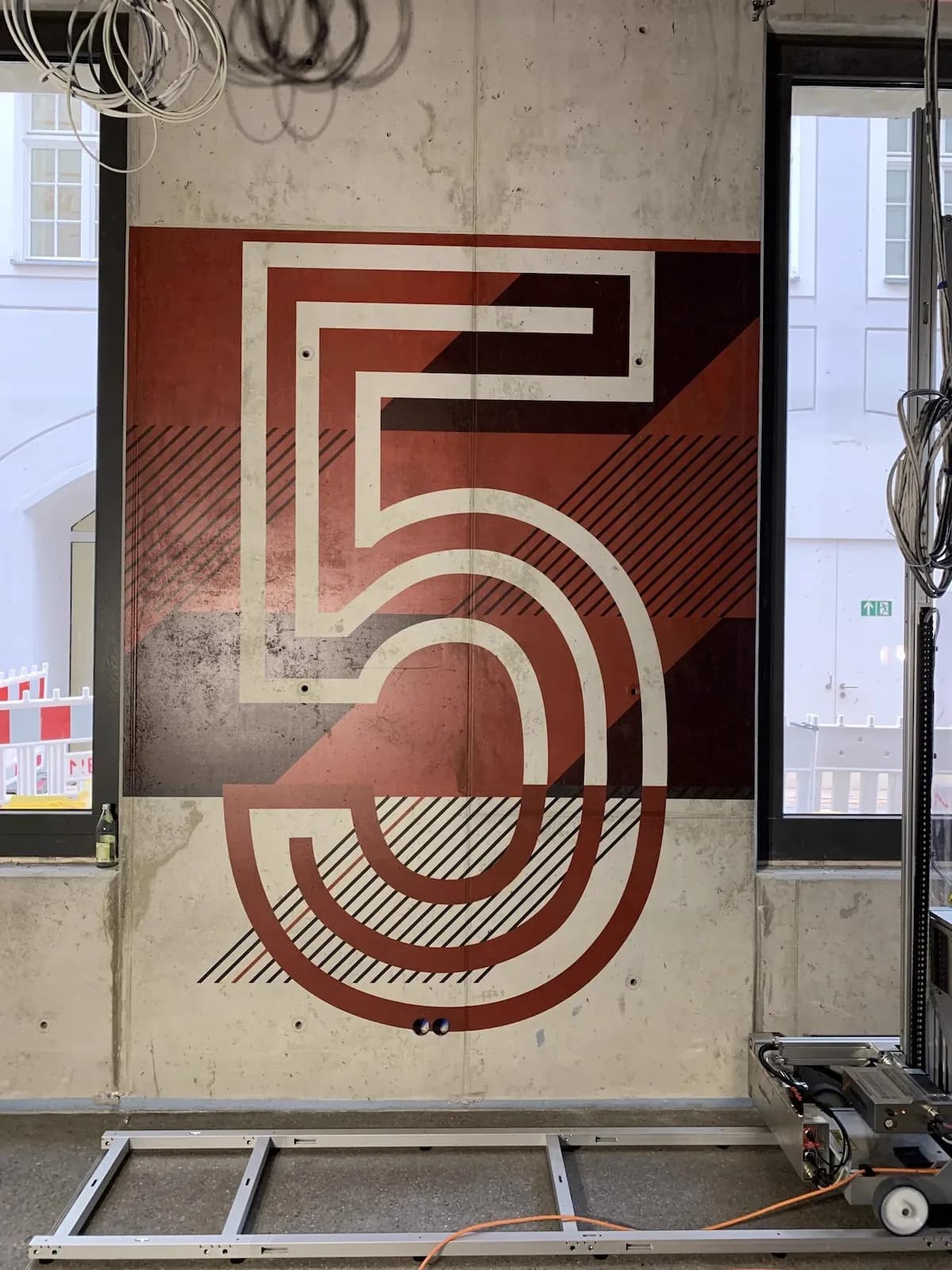 Large format number typography on concrete wall with printing robot by InnoPrint KSA